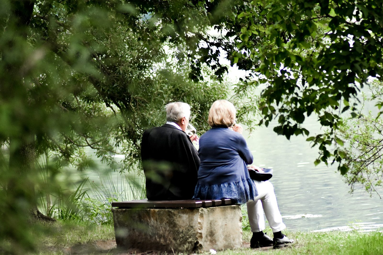 An older couple sitting together outdoors
